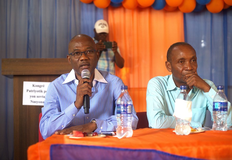 Former Senator Kely Bastien (left) speaking during the Patriotic Congress for the National Rescue held at the Public University of North of Cap-Haïtien (UPNCH) on June 11, 2025. Photo by Onz Chery/ The Haitian Times.

