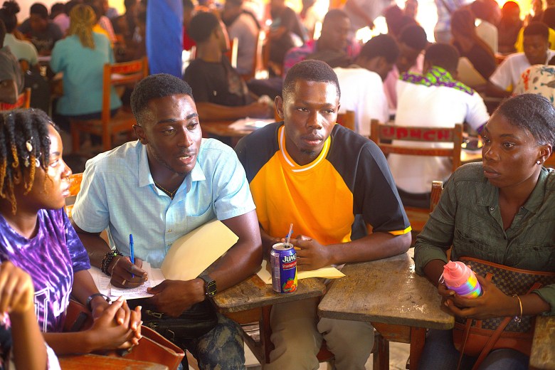 Public University of North of Cap-Haïtien (UPNCH) students brainstorming on possible solutions to the gang violence crisis. Photo by Onz Chéry/ The Haitian Times.
