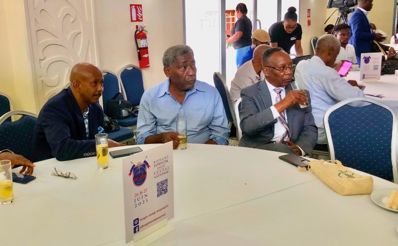From left to right: Former Prime Minister Jean Michel Lapin, writer Garry Victor and lawyer Annibal Coffy, attending presentations by speakers from various sectors on the first day of the Patriotic Congress for National Rescue in Pétion-Ville on June 26 and 27. Photo by Juhakenson Blaise/The Haitian Times.
