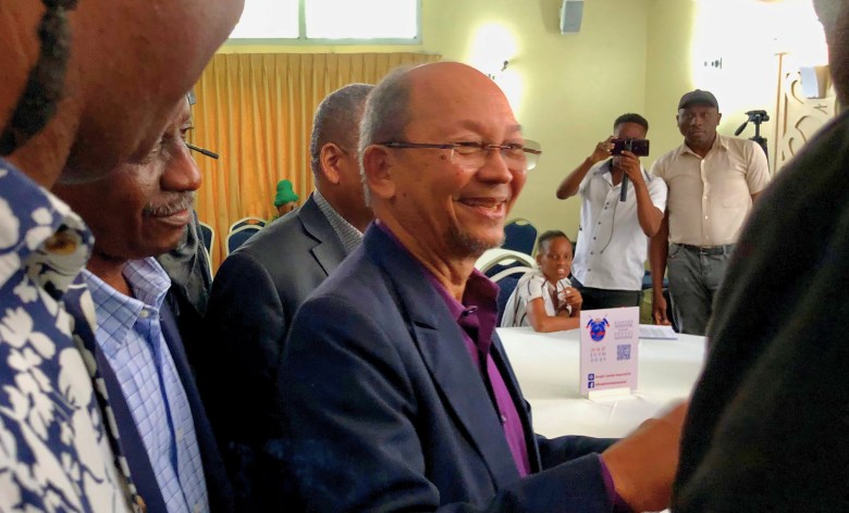 Leslie Voltaire, a member of the Transitional Presidential Council (CPT), greets some attendees as he leaves after delivering a report on the CPT’s actions and answering questions from participants on the final day of the Patriotic Congress for National Rescue in Pétion-Ville on Friday, June 27. Photo by Juhakenson Blaise/The Haitian Times.