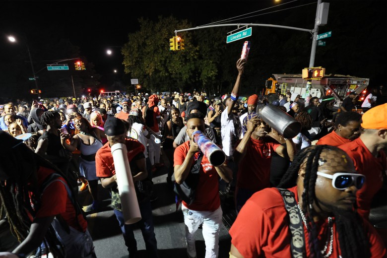 Plezi Rara marched for three hours through the streets before entering Prospect Park followed by several NYPD vans. Haiti born Marie Daniel told the Haitian Times “The Energy was so powerful it was calling me” She traveled for the first time in Brooklyn from Montreal for the event. Photo by Bill Farrington