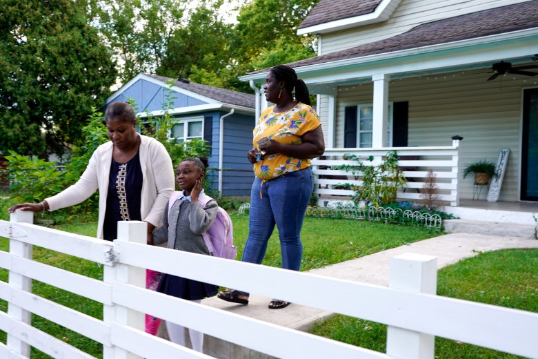 The Menelas-Horrace family, Brooklyn transplants who moved to Indianapolis six months prior, head out from their East Side home en route to school in September 2023. Photo by Dieu-Nalio Chéry/The Haitian Times 