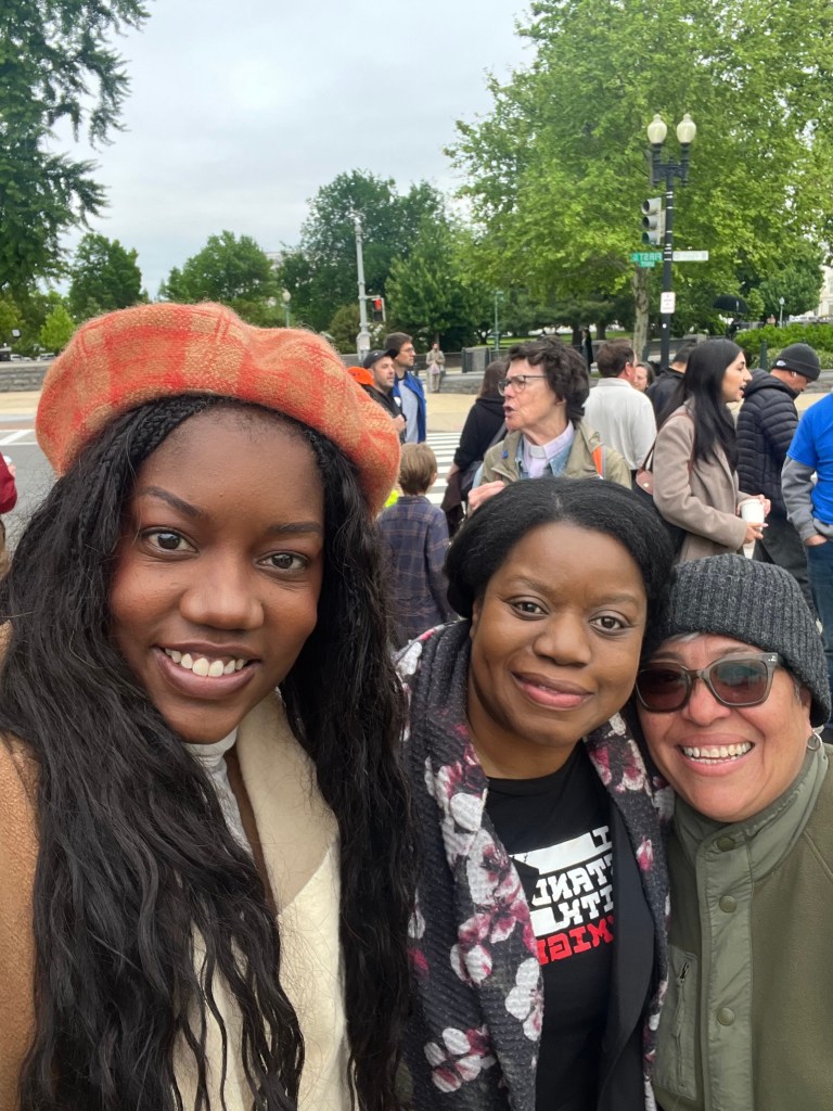 Claudette David (left) and Damaris Rostren (right) of Faith Action International pose for a photo with Guerline Jozef (center), executive director of the Haitian Bridge Alliance, outside of the Supreme Court in Washington, D.C., on Wednesday, April 29, 2026. Photo courtesy of Claudette David