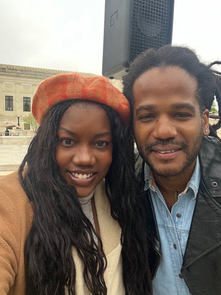 Claudette David (left) of Faith Action International and musician Paul Beaubrun (right) pose for a photo outside of the Supreme Court in Washington, D.C., on Wednesday, April 29, 2026. Photo courtesy of Claudette David