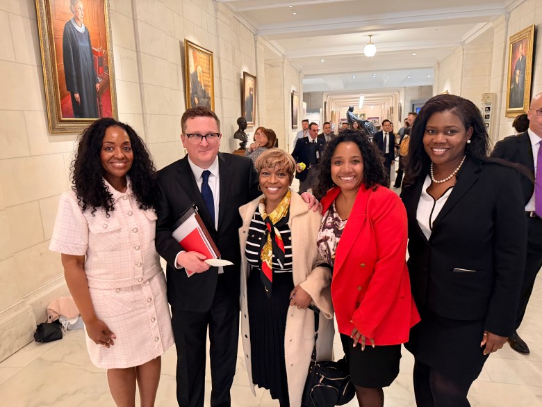 Members of the Haitian Lawyers Association of New York (HALANY) pose for a photo with Geoff Pipoly, the attorney who represented Haitian TPS holders during the organ arguments, inside the Supreme Court in Washington, D.C., on Wednesday, April 29, 2026. Photo courtesy of Sandra Dieudonne