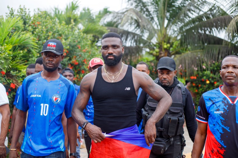 Frantzdy Pierrot walks among the crowds in the streets of Bas-Limbé, Haiti, on Friday, July 10, 2026. Photo by Ketlain Difficile for The Haitian Times.
