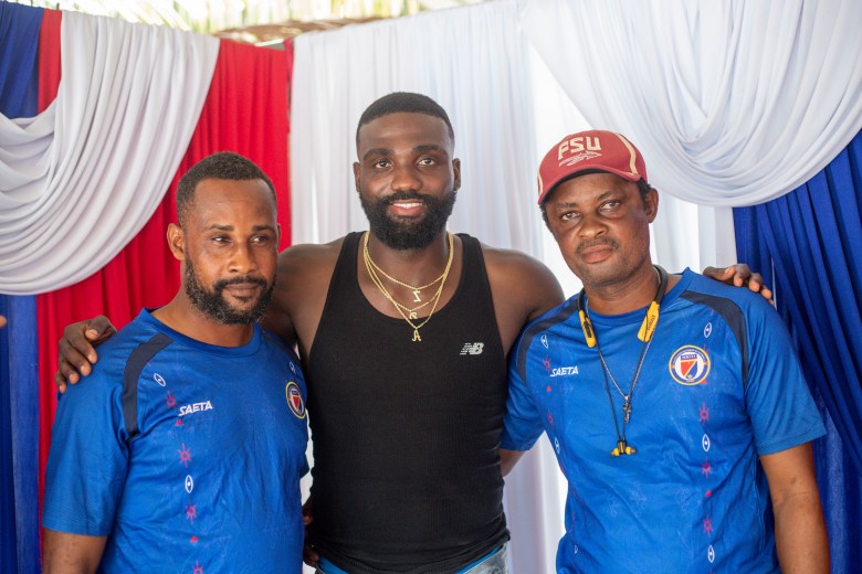 Frantzdy Pierrot poses with a relative and a childhood friend in Bas-Limbé, Haiti, on Friday, July 10, 2026. Photo by Ketlain Difficile for The Haitian Times.