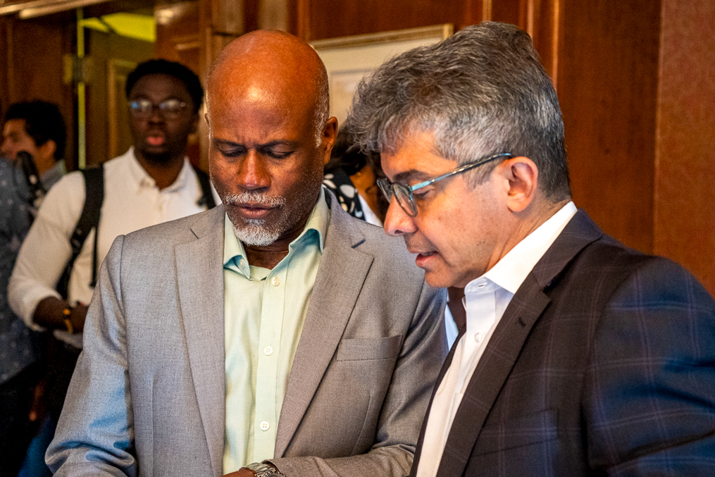 The Haitian Times founder and director of partnerships at URL Media, Garry Pierre-Pierre, left, speaks with José Bayona, founder of Grassroots Strategies, during “Leading Labor in a Changing Immigration Landscape” at Brooklyn College in Brooklyn on July 30, 2026. Fredner Cayemitte / The Haitian Times