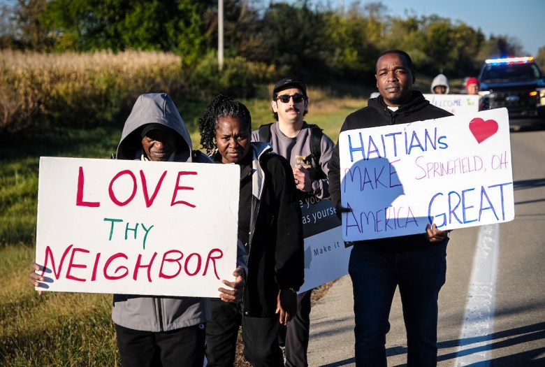 Procession participants pose for a photo during the pilgrimage in Springfield, Ohio, demanding an end to ICE tactics harming Haitian families on Wednesday, October 21, 2026. 
